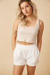 Smocked waistband details on the white summer shorts by Ottawa brand, Viens Avec Moi.