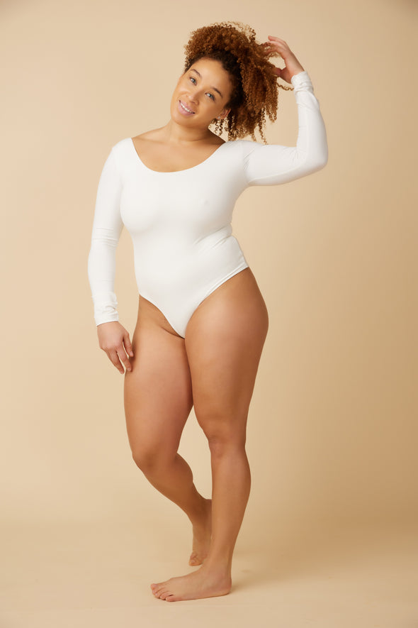 Versatile white long sleeve bodysuit with a scoop neckline and back designed in Canada by Ottawa brand, Viens Avec Moi.