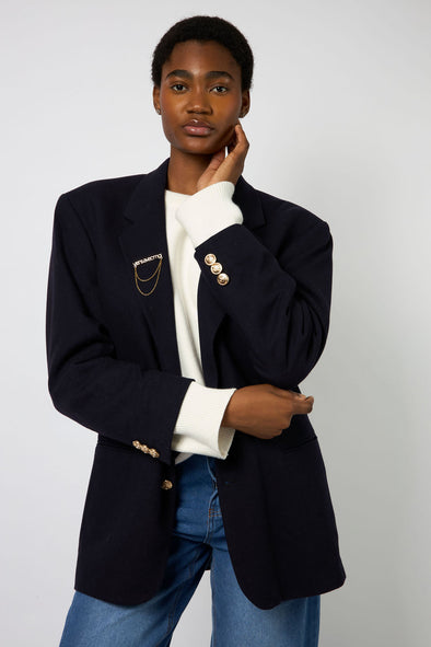 Oversized Vintage Black Blazer. All buttons have been replaced with our beautiful gold detailed buttons. Comes with our new custom designed viens avec moi broach. Fits like a L/XL.