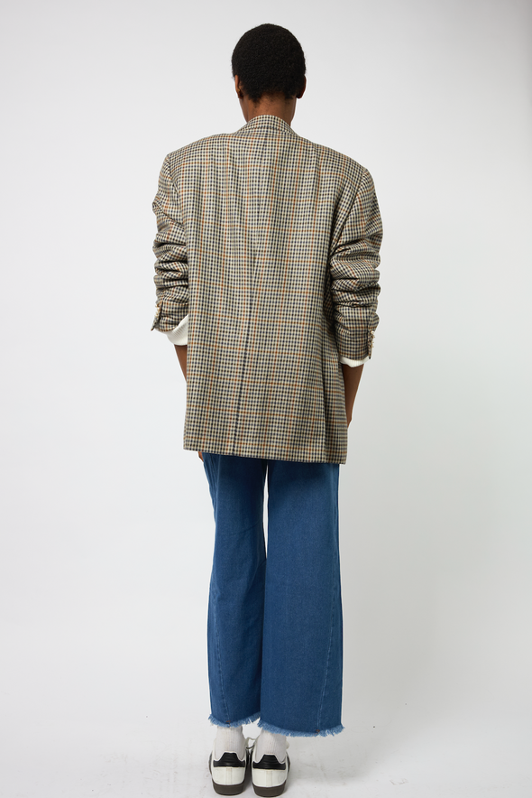Oversized Vintage Check Print Blazer. All buttons have been replaced with our beautiful holographic buttons. Comes with our new custom designed viens avec moi broach. Fits like a L/XL.