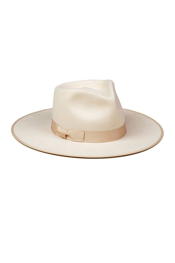 The Ivory Rancher by Lack of Color is designed to make a statement. The 100% Australian wool fedora features a tonal gold bow.