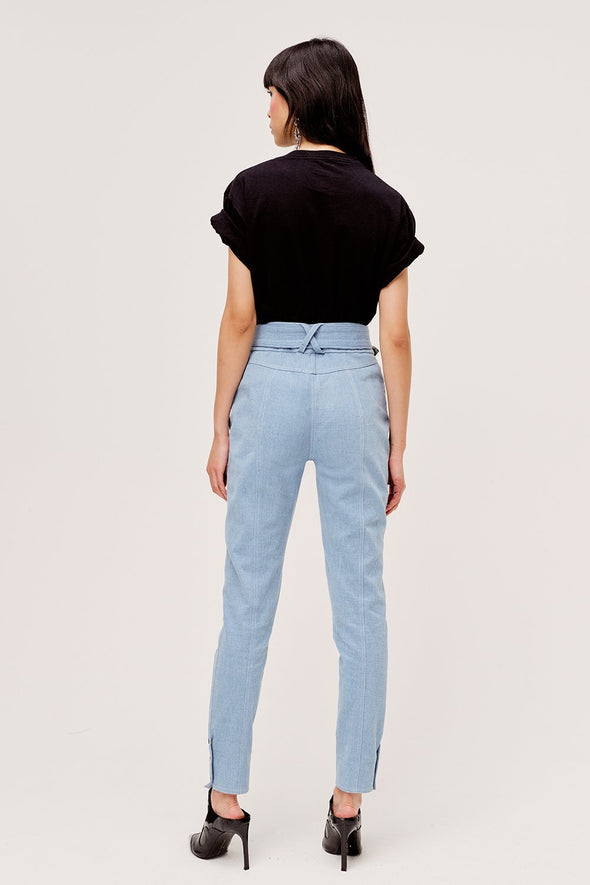 Light blue western inspired high waist pants from For Love & Lemons with contrast stitching and functional metal button details.