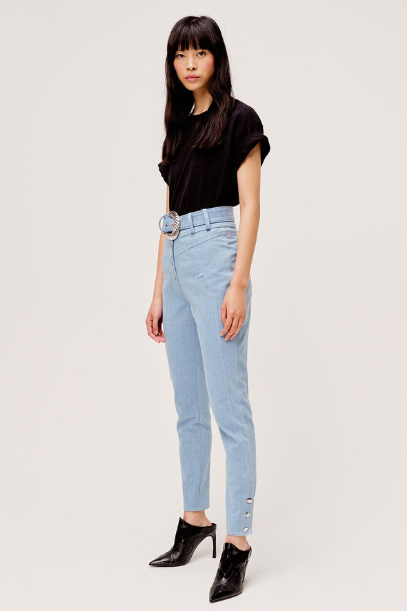 Western inspired light blue high waisted pants from For Love & Lemons with removable belt and contrasting metal button details.