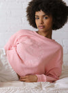 Pink crew neck sweater with a slightly boxy fit and cropped length with an embroidered logo design on front and drop shoulder.