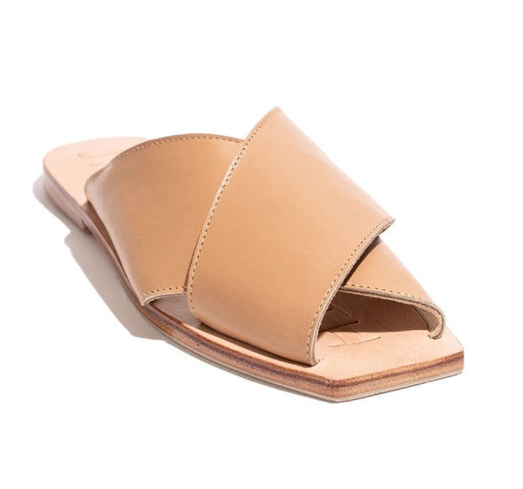 The Poseidon Slide in Tan by James Smith is a versatile slide. The sandal features beautiful leather cross straps in a tan leather with a pressed leather sole.