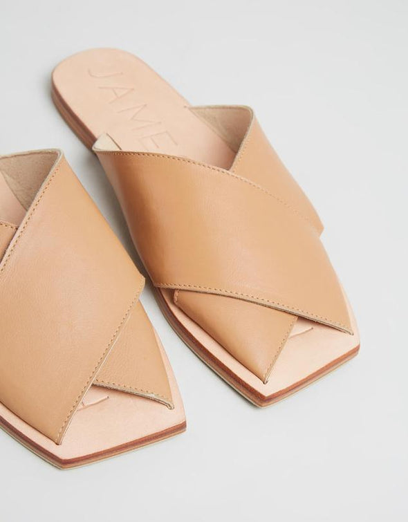 The Poseidon Slide in Tan by James Smith is a versatile slide. The sandal features beautiful leather cross straps in a tan leather with a pressed leather sole.