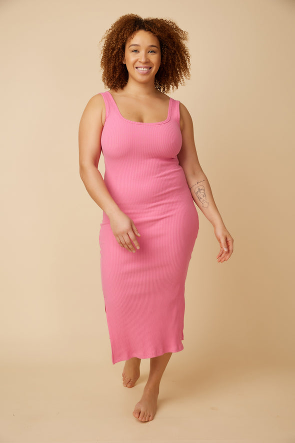 The Girls' Night Dress is a pink ribbed bodycon dress with a square neckline and side slits designed in Canada by Ottawa brand, VIens Avec Moi.