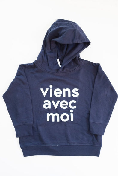 VAM Toddler & Youth Hoodie in Navy. Cotton fleece hood with a white Viens Avec Moi logo screen print on the front.