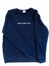 The Viens Avec Moi Cozy Crew Sweater is an oversized, navy blue crew neck sweater with a white viens avec moi print across the chest.